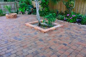 <img src="bricks.jpg" alt="orange brick pavers with border wall border and fire pit">