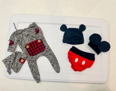 Baby clothes with Mickey Mouse theme.