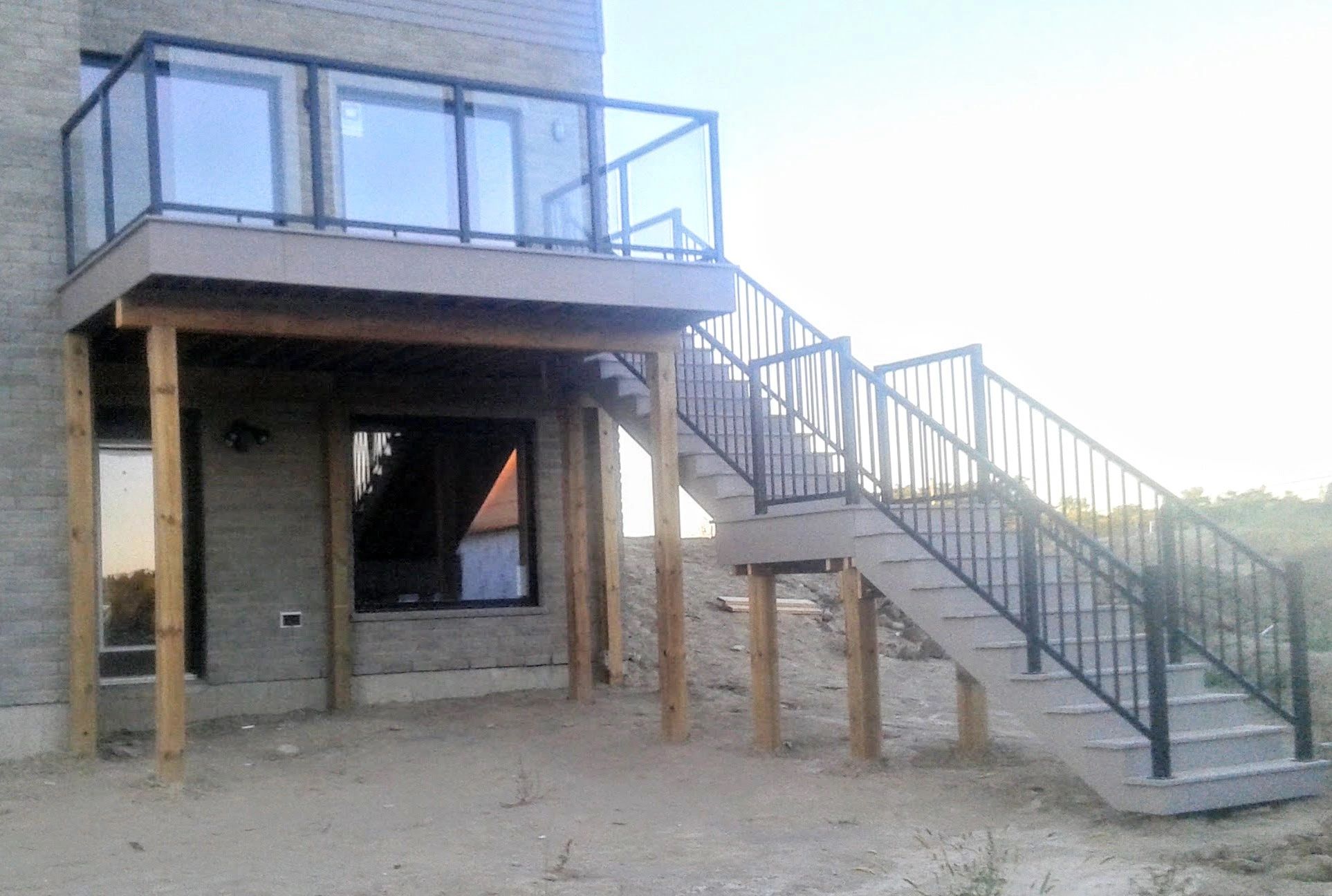 Custom pressure treated deck built by Forrest City Fencing London Ontario