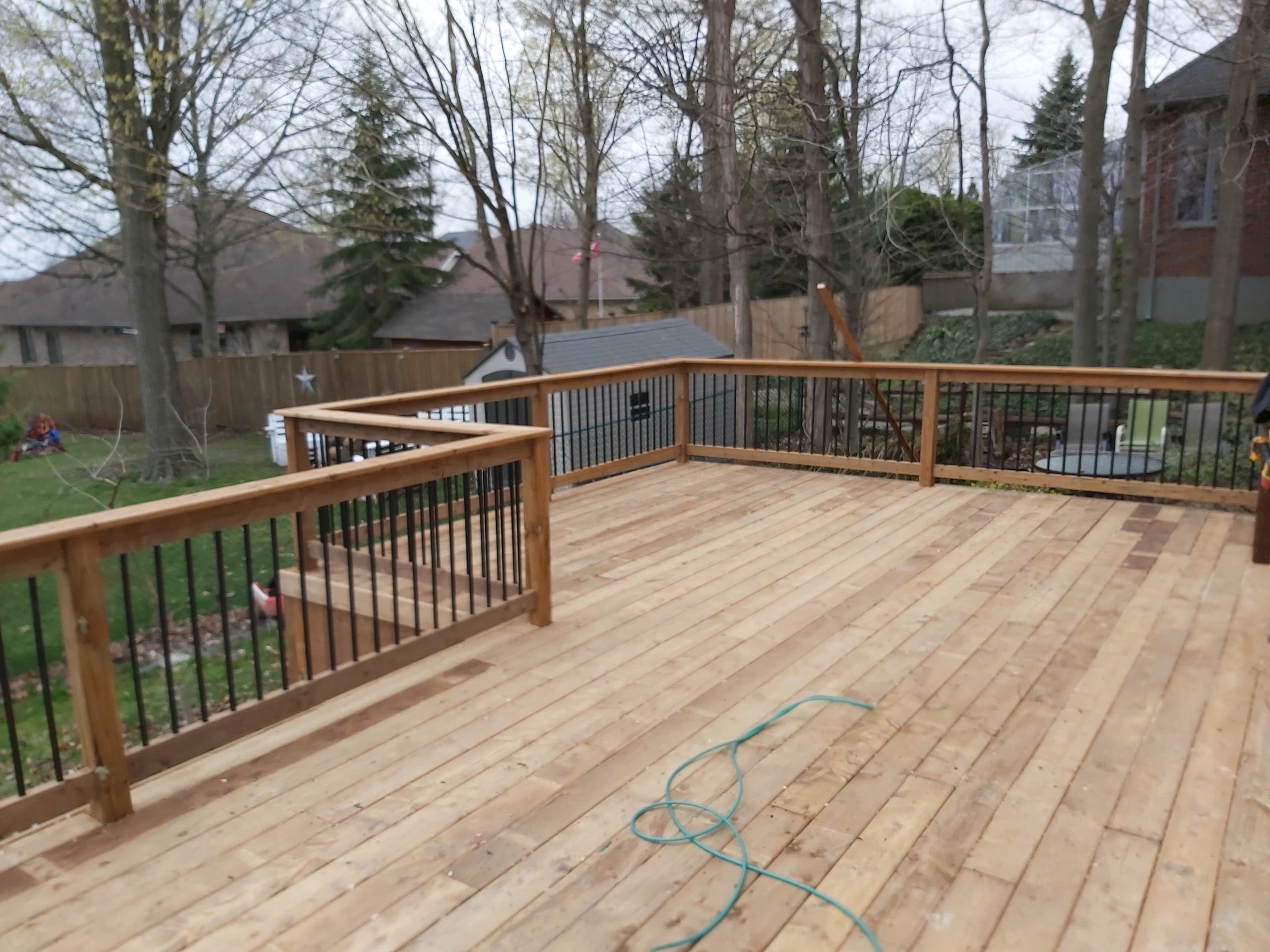 Top view of custom pressure treated deck with clean board layout