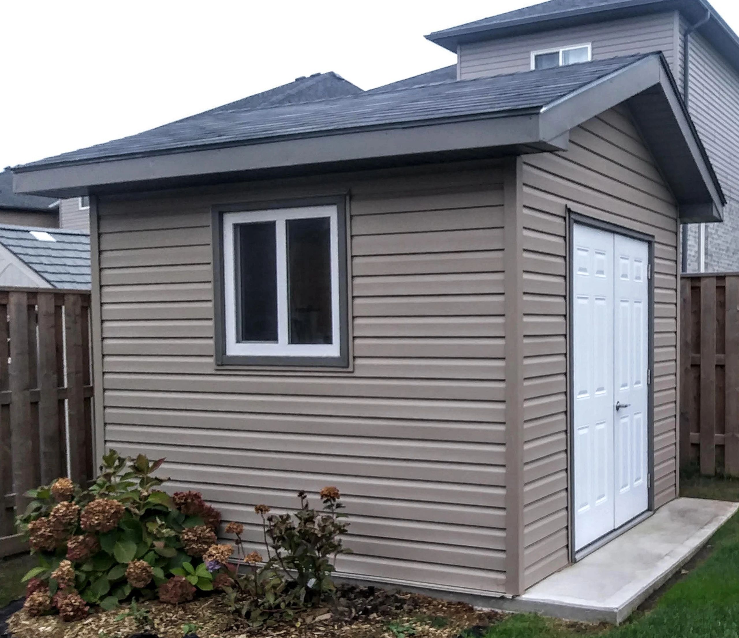 10x12ft siding shed built on concrete pad in London Ontario