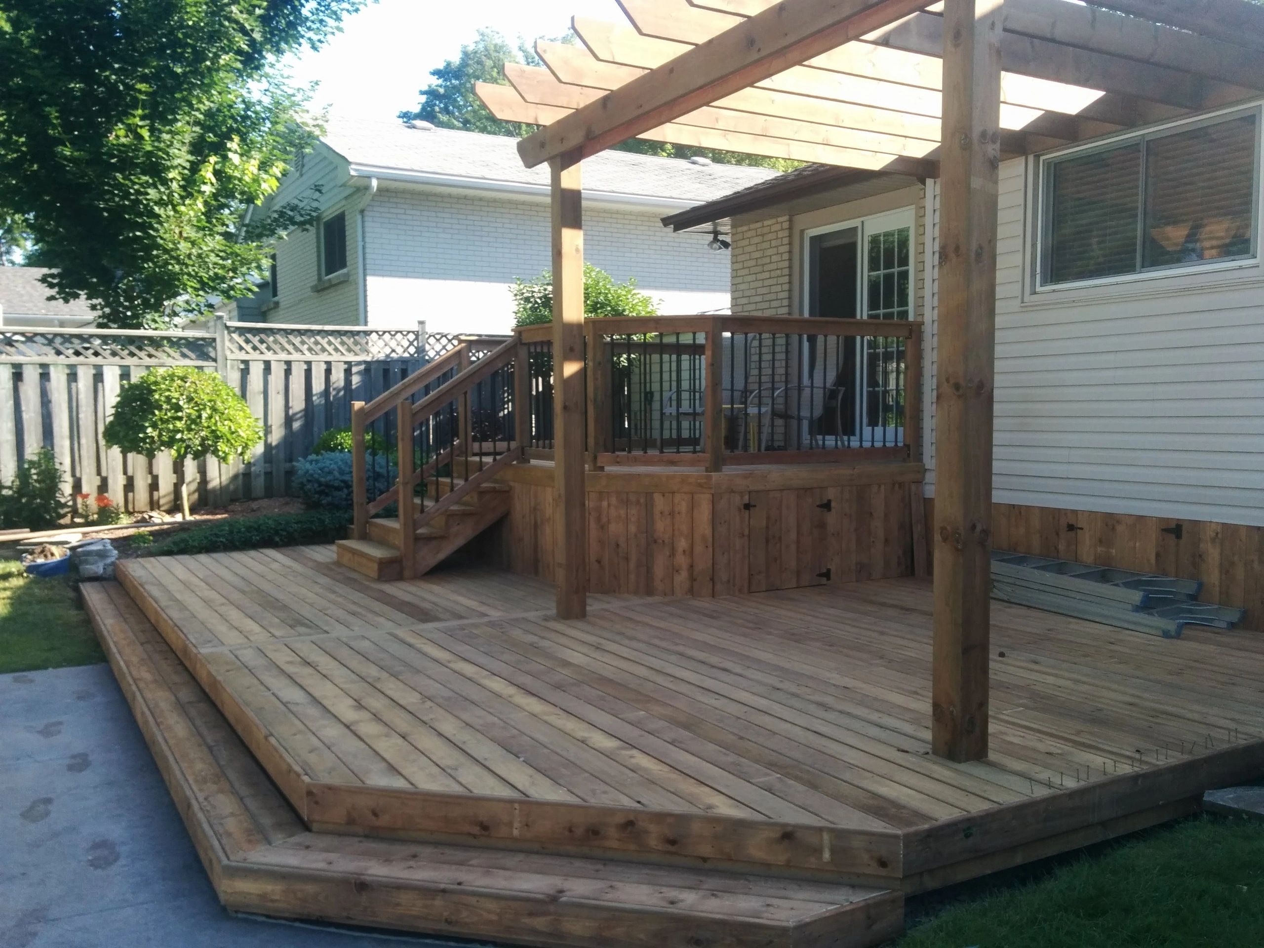 Patio deck built off patio doors with stairs, London Ontario