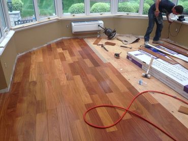 water damage to a conservatory floor and replace with new hardwood