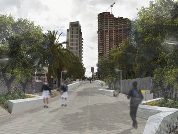 Personas caminando en una calle urbana con edificios y árboles.