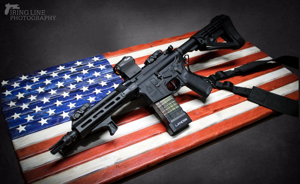 300 Blackout AR Pistol photographed on a wooden American Flag display. Photo by Firing Line Shooting