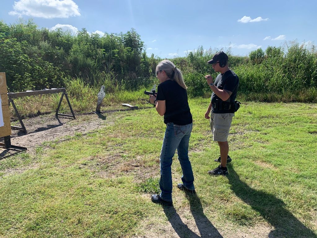 Blake providing basic instruction for a new shooter on the Range.