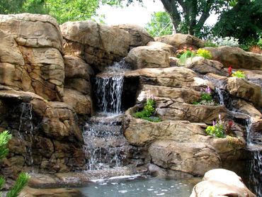 Concrete rock pond with waterfall.