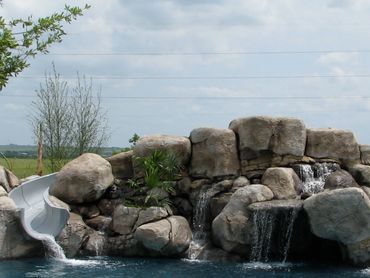 swimming pool grotto slide waterfall hot tub