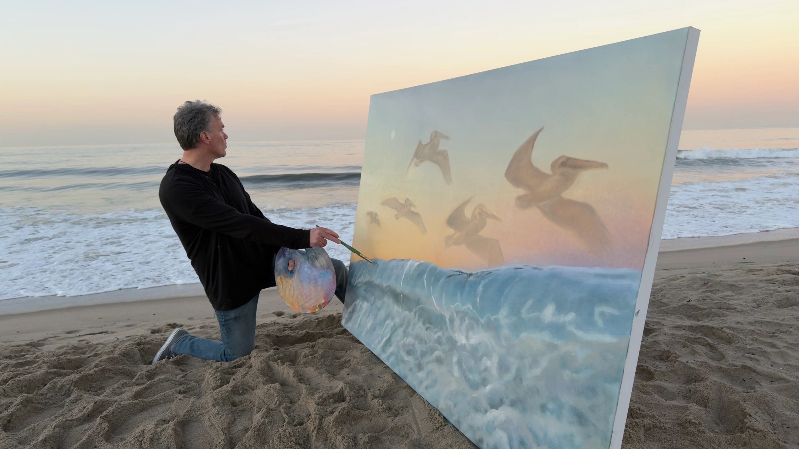 James Havens painting a coastal canvas on the beach in Southern California