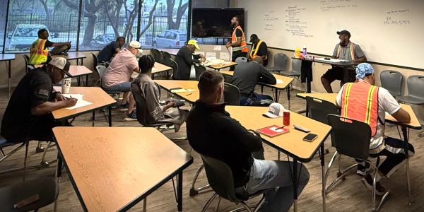 Construction workers in a classroom training session.