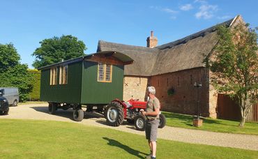 Shepherds Hut being moved in to position.
