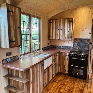 Handmade kitchen with copper work top.