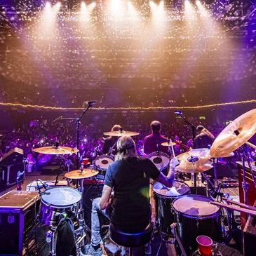 Drummer on a stage in front of a live audience