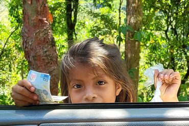 A young girl holding money