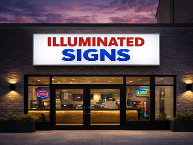 Storefront with a bright sign reading 'ILLUMINATED SIGNS' at dusk.