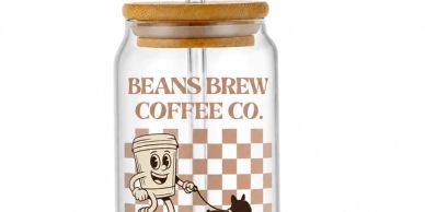 Glass jar with Beans Brew Coffee Co. logo and cartoon character.