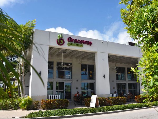 Exterior view of Graceway Gourmet restaurant with outdoor seating.