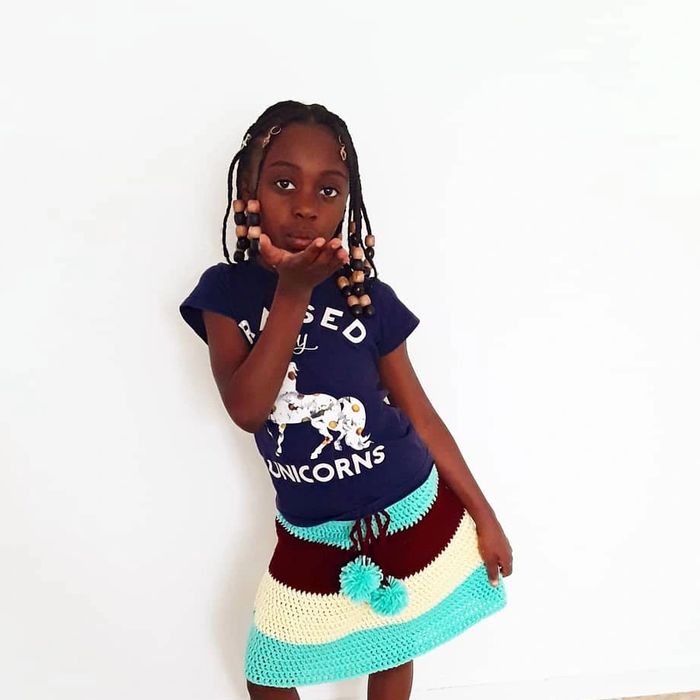 This is a skirt fit for the average 7 yr. old. 
It has 3 colors a tie at the waist with pom-poms han