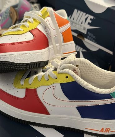Colorful Nike sneakers with red, yellow, blue, and orange accents.