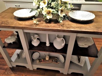 The photo shows a front view of the kitchen island.