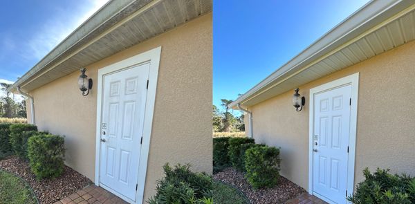 Soft washing in Palm Coast, removing black streaks, algae, and organic buildup from homes.