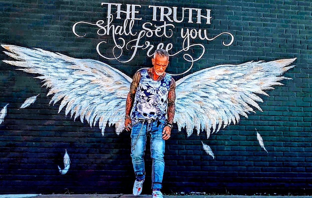 HIV AIDS long term survivor 80s Bob Bowers activist Houston Texas The Truth Shall Set You Free mural