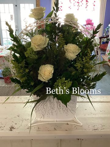 White roses, mini green hydrangea, and solidago. 