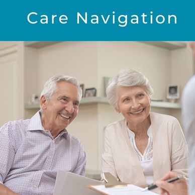 Elderly couple happily discussing care options with a professional.