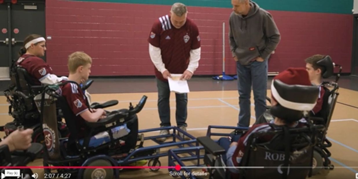 Team preparing for a play in power soccer