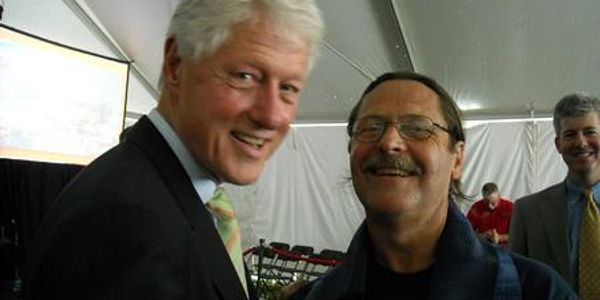 President Clinton enjoys air conditioning during outdoor events, pictured here with George. 