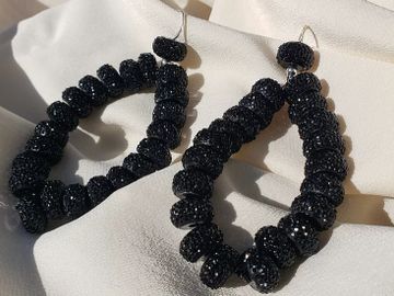 Hoop style earing with sparkly black beads