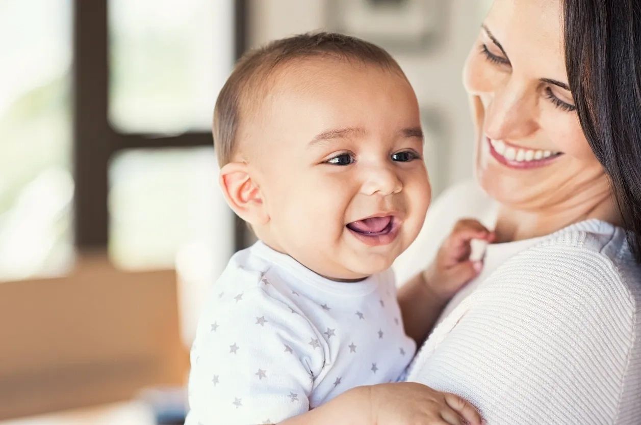 Nanny and baby smiling