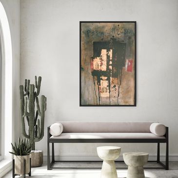 Minimalist living space with abstract art and cacti.