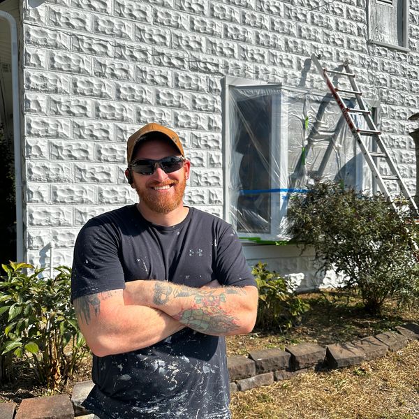 Joe Thornberry in front of freshly painted local church