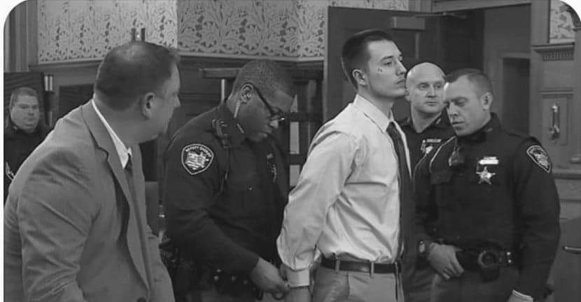 Austin being arrested after trial.