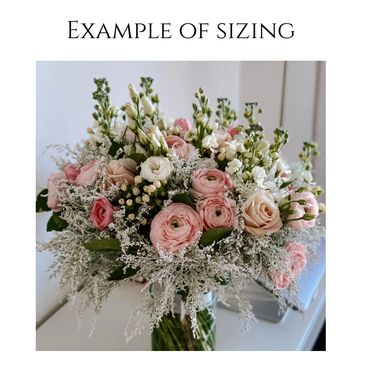 A beautifully sized bouquet with pink and white flowers.