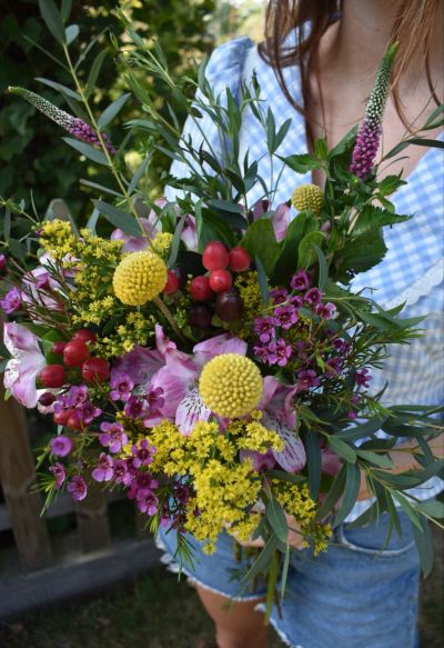 Colorful bouquet with various flowers and greenery.