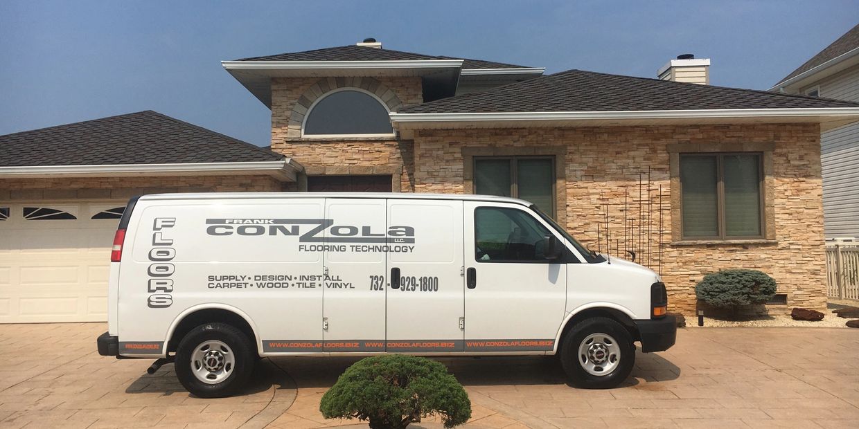 ConZolaFloors.Biz van in front of customer's home.