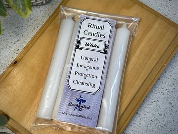 Package of white ritual candles for protection and cleansing.