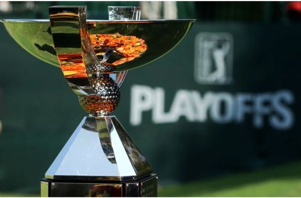 Shiny golf trophy with PLAYOFFS banner in background.