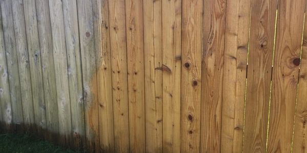 Pressure washing fence