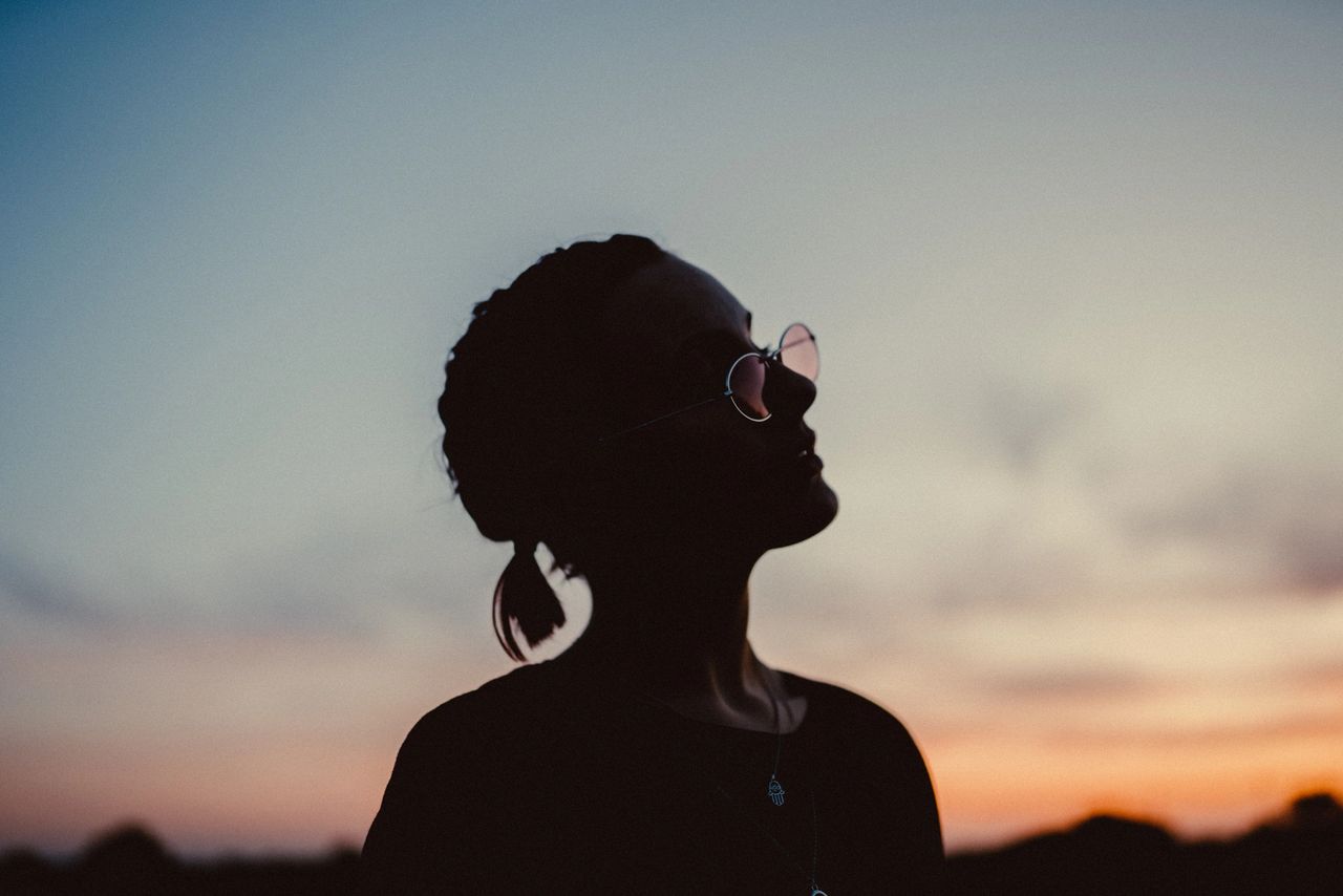 girl looking up at sky, sunglasses