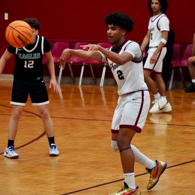 High school basketball players in action during a game.