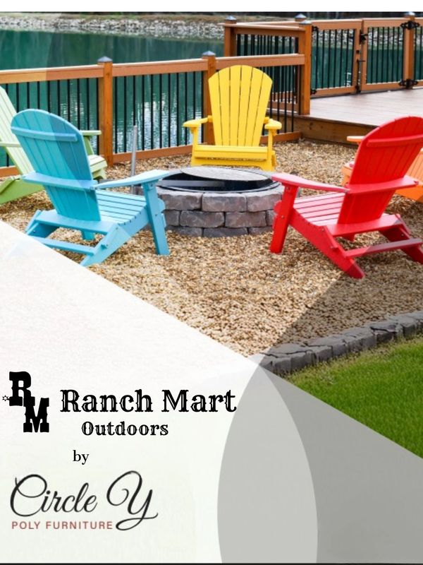 Poly Adirondack chairs by a fire pit by the deck overlooking the lake.