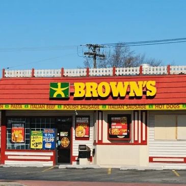 Brown's fast-food restaurant with a red roof and yellow signage.