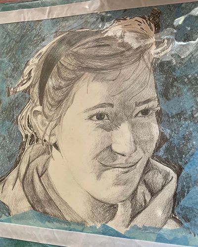 Detailed pencil sketch of a woman with a headband and a subtle smile.