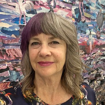 A woman with gray and purple hair stands before a colorful, collage-like background.
