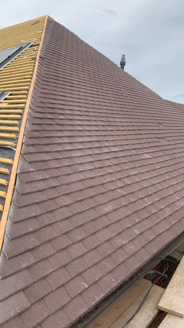 New tiles being laid on roof