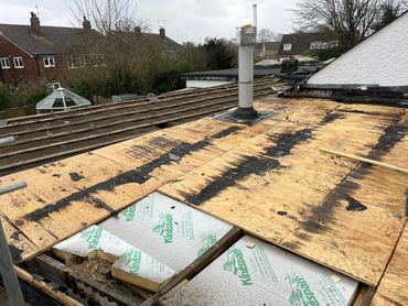 Flat roof being repaired