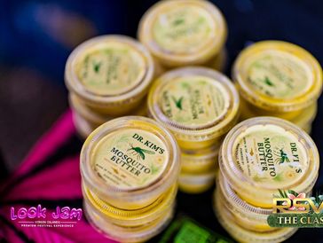 Stacks of Dr. Kim's mosquito butter containers.